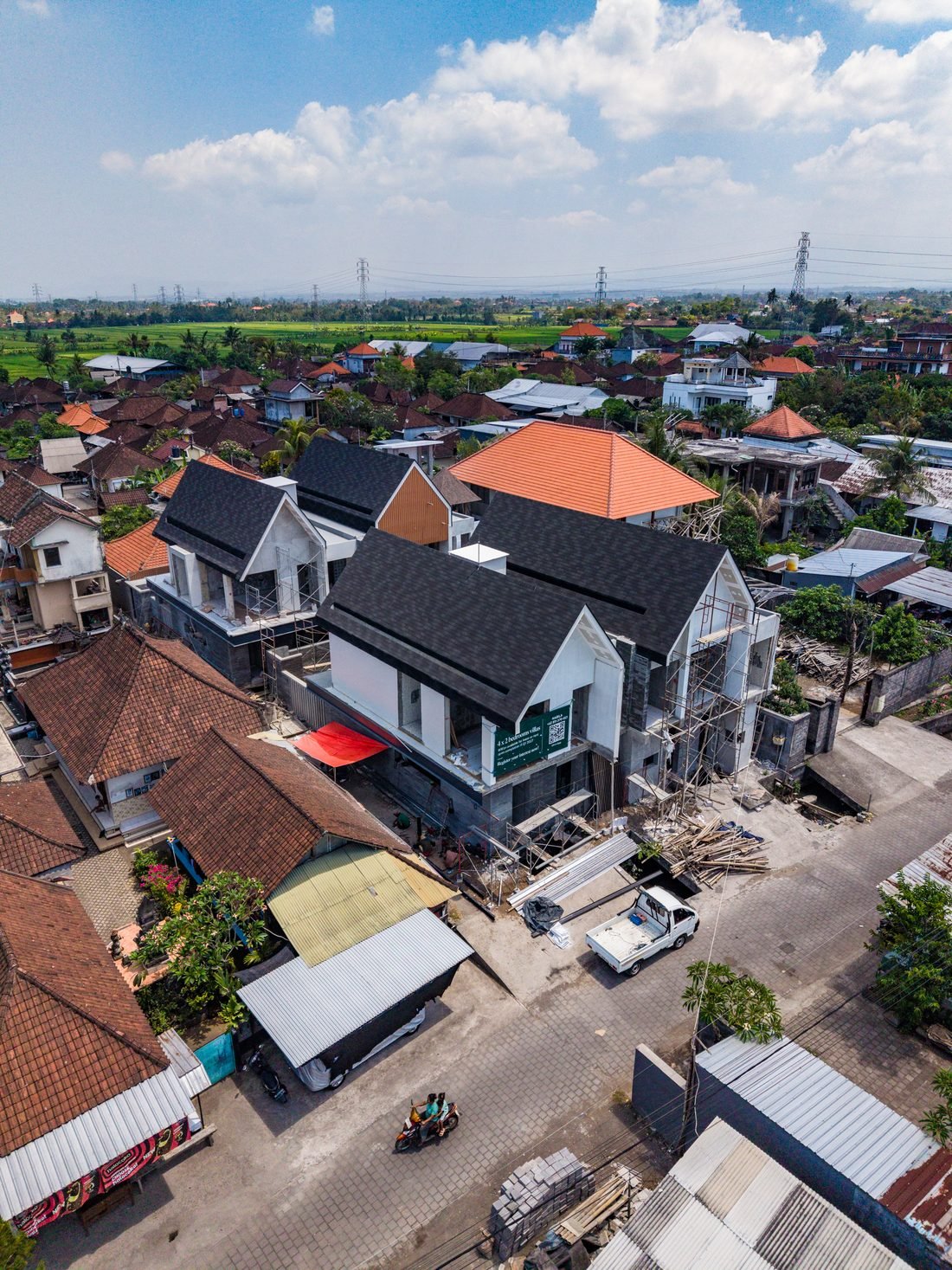 The four Four Palms villas seen from the lane during construction, 22 September 2026